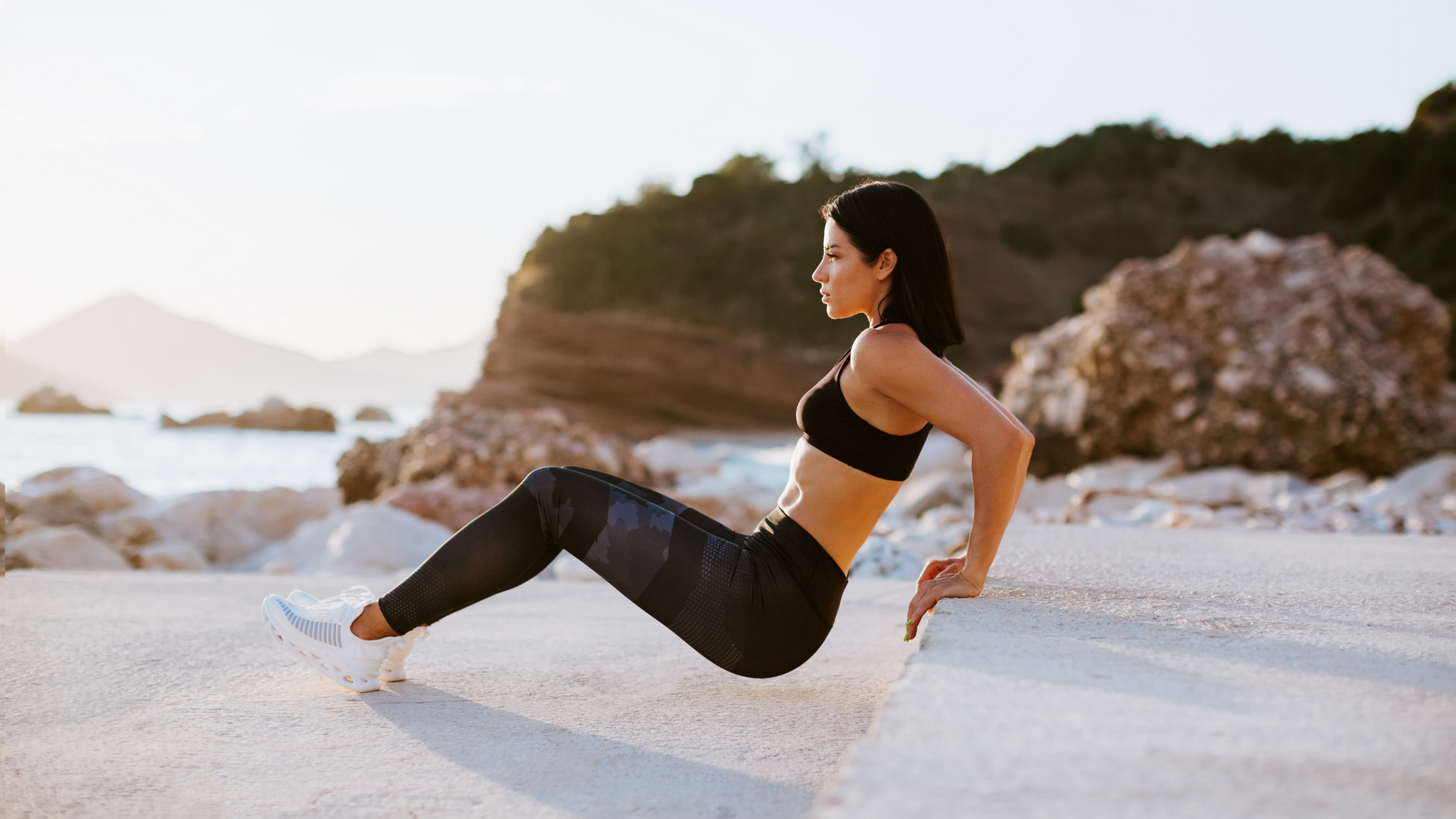 women working out on beach